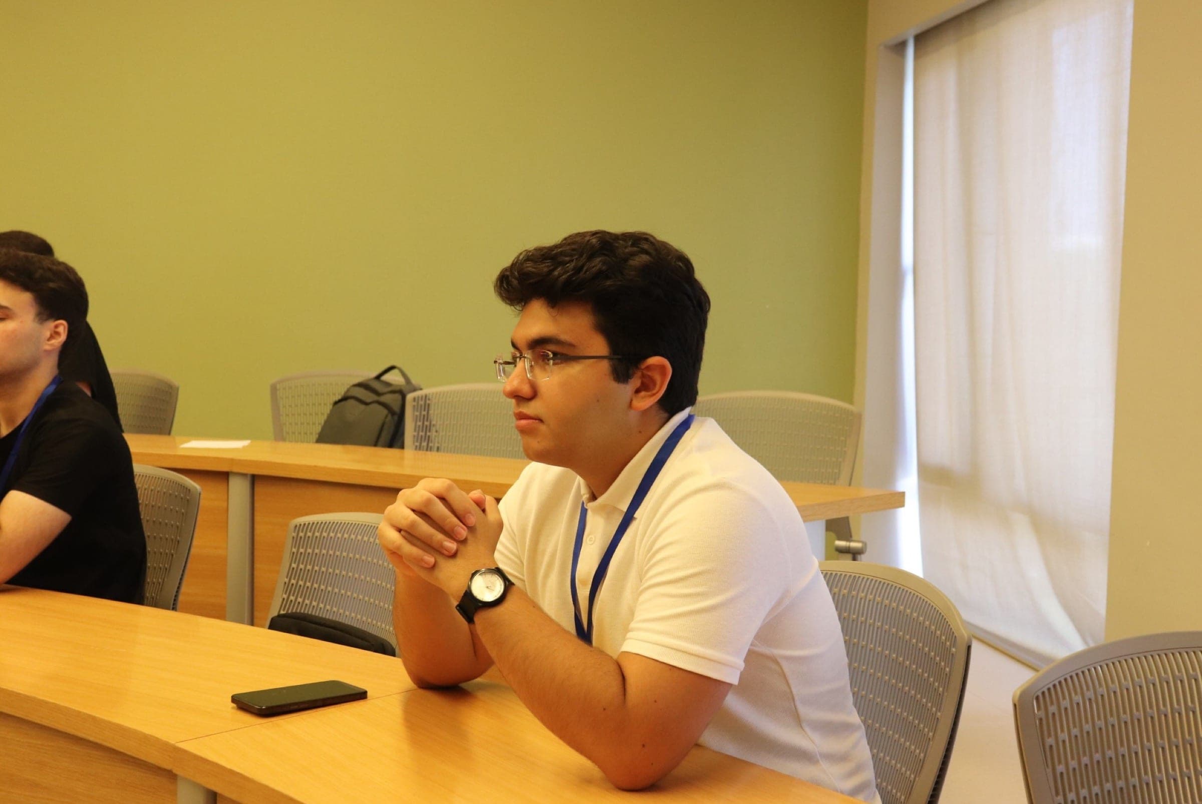 A student at the seminar desk taking part in the discussion.