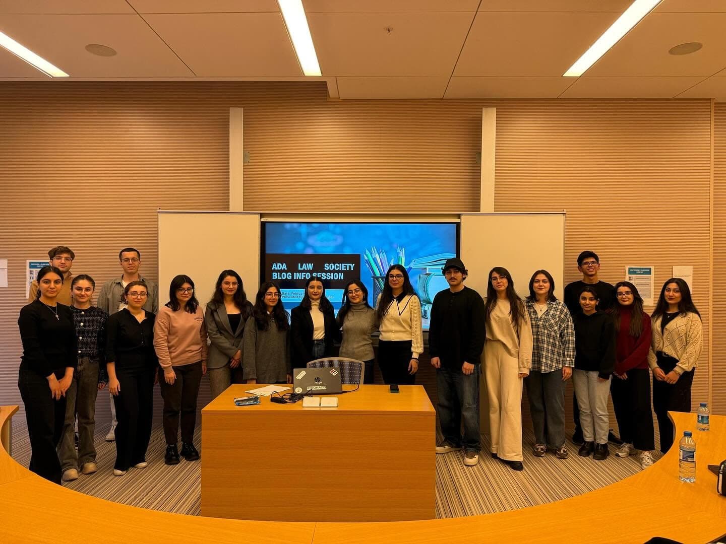 Students standing together in a seminar room in front of a screen showing the ADA Law Society Blog session slide.